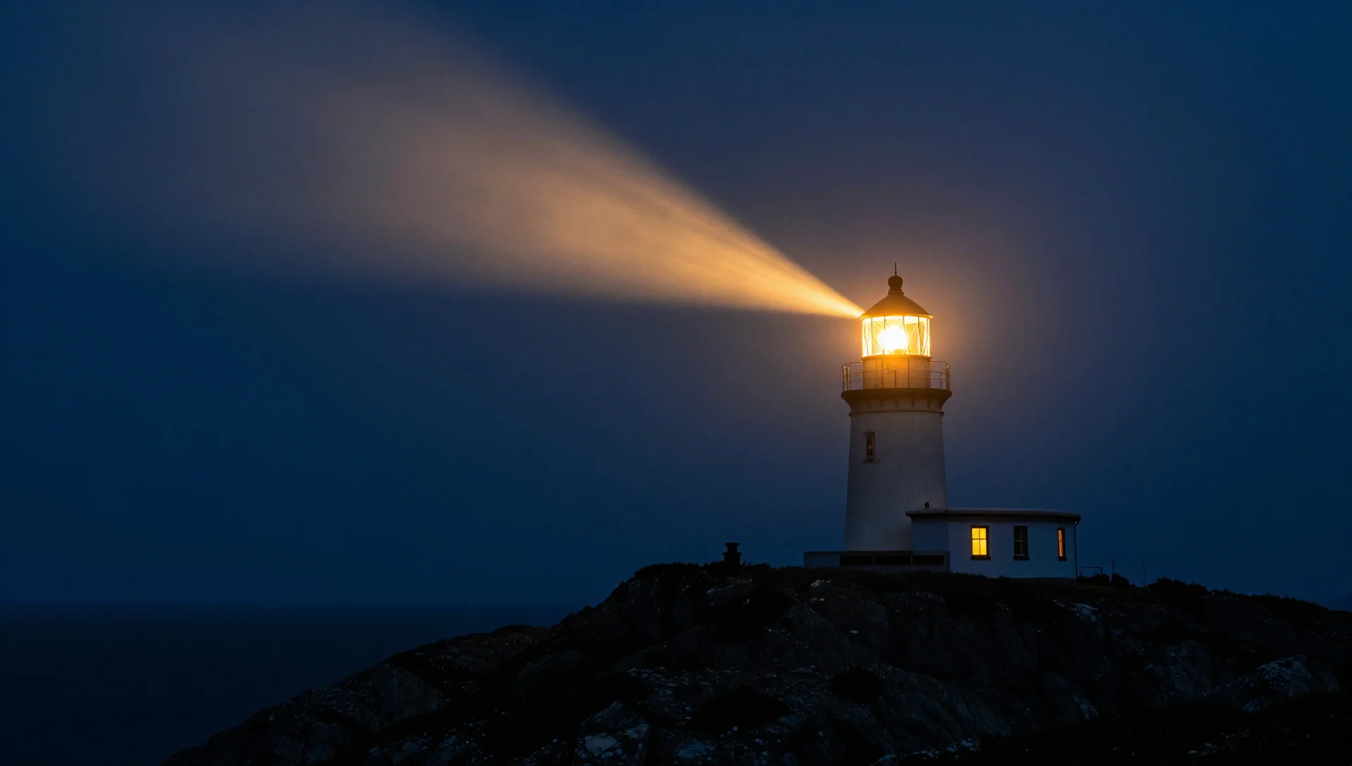 Glowing lighthouse beam cutting through night fog, representing 24/7 support availability.